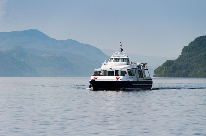Passenger cruise boat approaching on Loch Ness