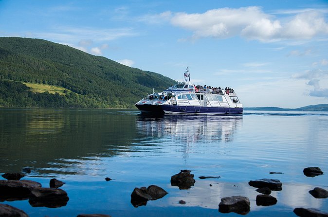 Jacobite boat with an open upper deck on Loch Ness